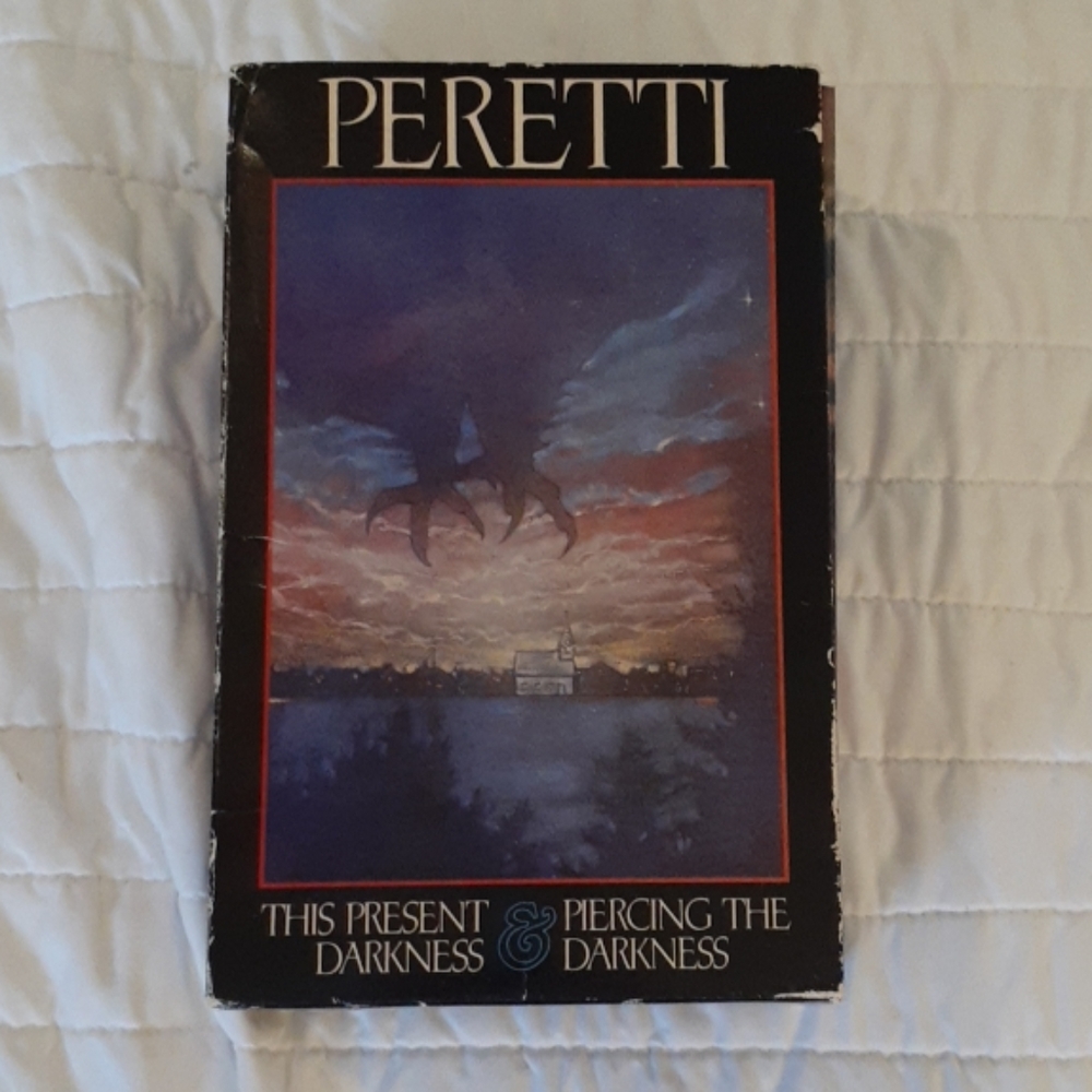 THIS PRESENT DARKNESS AND PIERCING THE DARKNESS